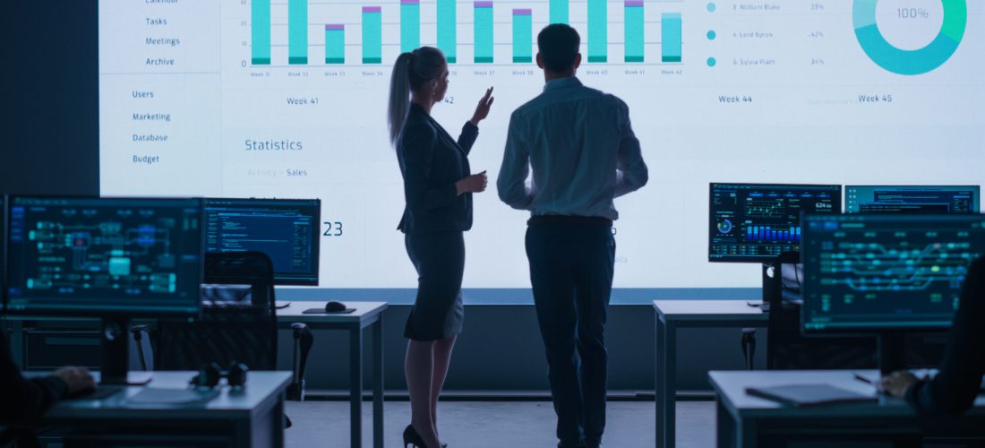 Project,Leader,,Chief,Executive,Discuss,Data,Shown,On,Big,Display.